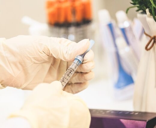 flu shot vile and syringe