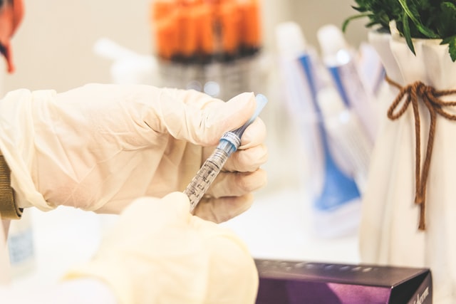 flu shot vile and syringe